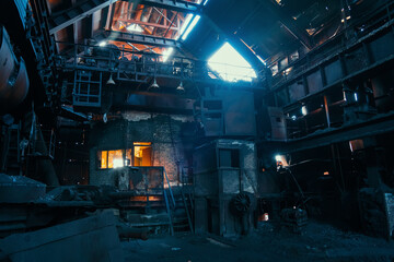 Old creepy and rusty abandoned metallurgical factory. Ruined industrial blast furnace.