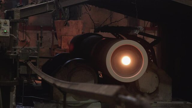 Rotating tube with melting metal in the factory