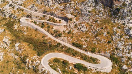 Aerial View, Car Driving Up a Curvy Mountain Road in Spain. Mallorca, Serra de Tramuntana.