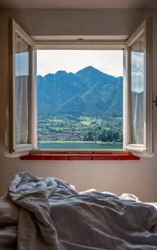 Mountain range seen through bedroom window