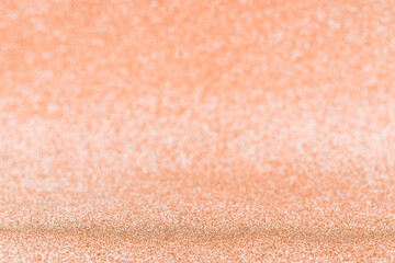 Golden abstraction. Christmas glitter gold background with bright sparkle bokeh texture for xmas shine silver pattern. Glamour effect in soft focus.