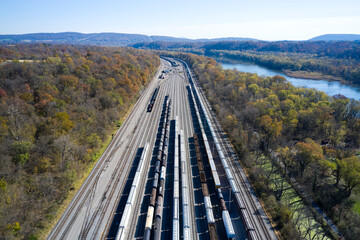 Aerial view of railroad cars waiting on tracks stretching along Chesapeake and Ohio Canal