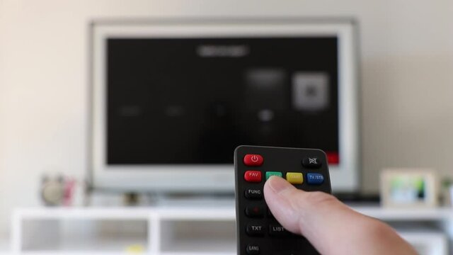control remote channel change hand holding control.