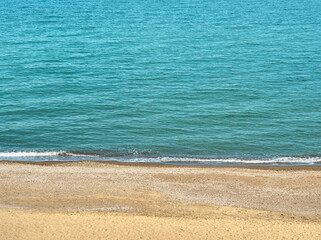 Blue sea wave on clean coast with sandy beach