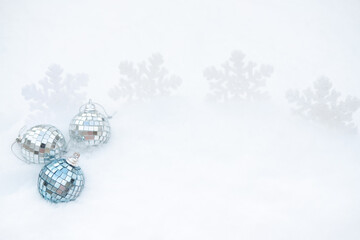 Christmas ornaments in the snow