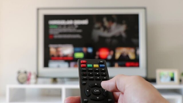 hand holding control tv remote control digital tv.