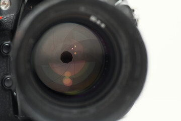 Camera lens in detail, open aperture with reflections