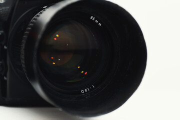 Camera lens in detail on white background