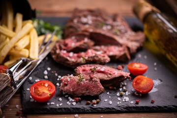 Sliced grilled medium rare beef steak