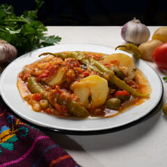 Mexican style cod called a la vizcaina on white background