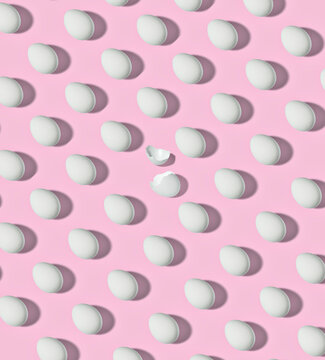 Pattern of white chicken eggs against blue background
