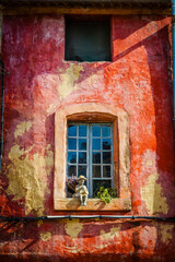 Fototapeta na wymiar Colourful window in the town of L’Isle-sur -la-Sorgue, Provence, France