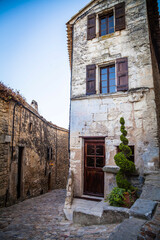 Fototapeta na wymiar Old houses in the streets of the ancient village Lacoste in Provence, France