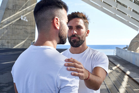 Gay man with boyfriend at Parc del Forum, Barcelona, Spain