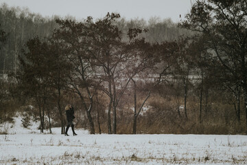 Obraz na płótnie Canvas person walking in the snow