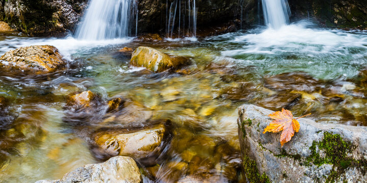 Waterfall and creek in Autumn