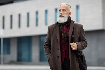 Thoughtful senior man walking home from job