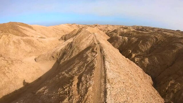 Motorcycle Riding on a Desert Trail