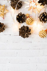 Christmas background with fir cones and straw holiday decor. Christmas wallpaper. Christmas, New Year composition with copy space for text. Flat lay, top view