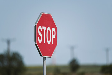 stop sign on a country road