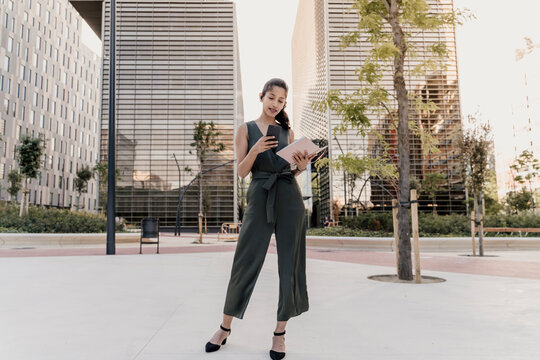 Barcelona, Spain. Young indian business woman outdoors on business district. Business, woman, job, break, formal, youg, working, etrepreneur, millenial, beautiful, 
