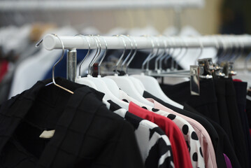 Fototapeta premium Clothes on hangers in a boutique store