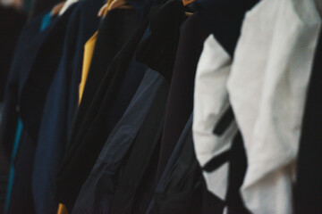 Clothes on hangers in a boutique store
