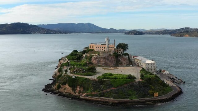 San Francisco, USA. Aerial footage of prison complex surrounded by Pacific Ocean. Alcatraz island on the clear day - view from above. High quality 4k footage