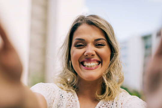 Young woman taking selfie outdoors