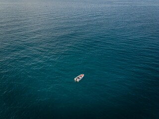 The lonely boat on blue