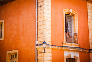 Colourful windows and houses in the ancient village of Roussilion in Provence, France