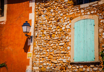 Colourful windows and houses in the ancient village of Roussilion in Provence, France