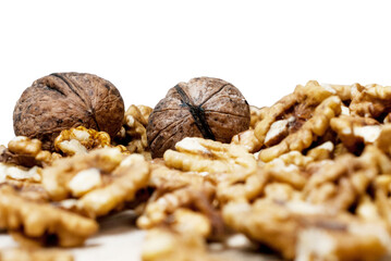 Walnuts with shell and without, on white background.