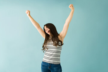 Happy woman celebrating and shouting her success