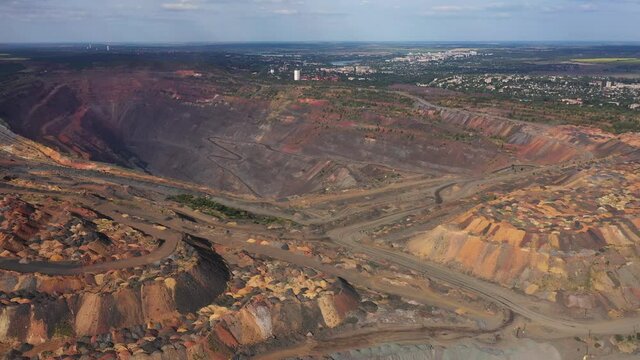 Large industrial open quarry aerial panoramic view.