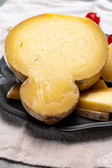 Italian semi hard matured caciocavallo cheese, handmade and aged in natural underground caves in...