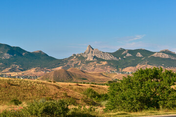A beautiful landscape with mountains and a city at their base on the journey
