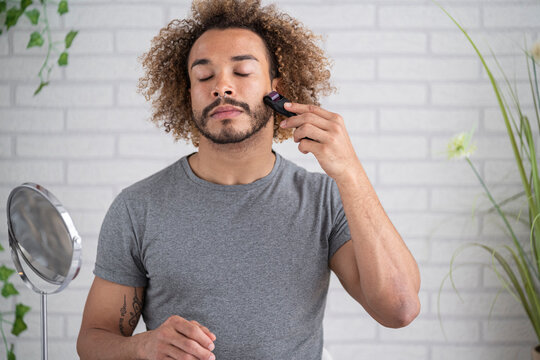 man Using Microneedling Roller, Elgoibar,Spain