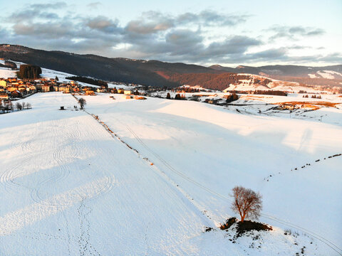 Camporovere, Altopiano di Asiago during winter season. Aerial drone view