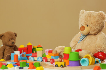Colorful cildren's toys on table, wooden, plastic and plush toys