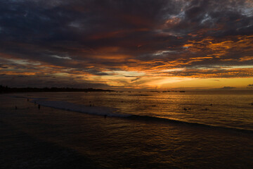 Naklejka na ściany i meble A high definition aerial sunset of the beach in Tamarindo Costa Rica.