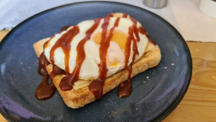 Fried egg on toast with brown sauce
