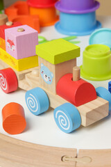 Colorful wooden train made of blocks. Eco friendly, sustainable toys.	