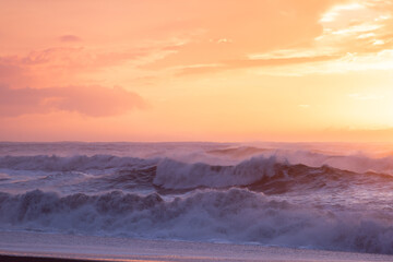 Beach wave at sunset