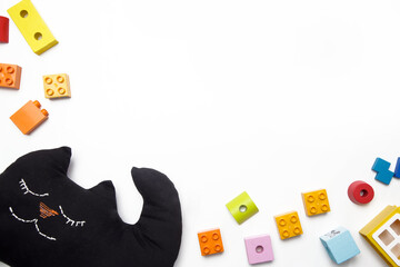 Children's toys on white background, top view with copy space