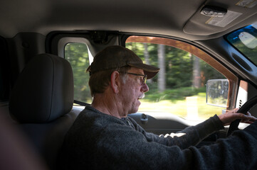 Male driver on highway with blurred outside