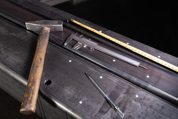 marking on a metal surface for drilling holes with a square and vernier calipers