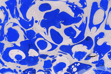 Colorful marble ink texture on watercolor paper background. Marble stone image. Bath bomb effect. Psychedelic biomorphic art.