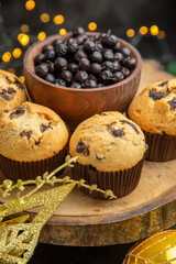 front view delicious fruity cakes around holiday tree toys on the dark background dessert cake sweet photo cream