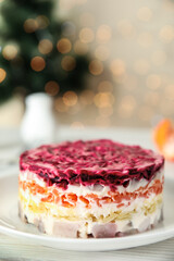 Herring under fur coat served on white wooden table, space for text. Traditional russian salad